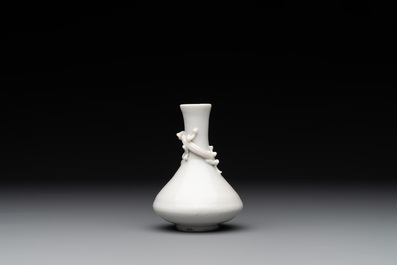 A small Chinese Dehua blanc de Chine 'dragon' bottle vase, Kangxi