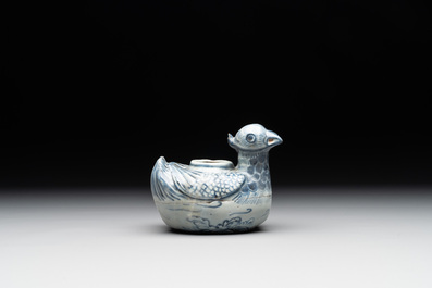 A Chinese blue and white 'double mandarin duck' ewer or water dropper on wooden stand, Ming, ca. 1500