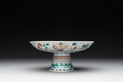 A Chinese famille verte covered jar, two vases mounted as lamps and a tazza, 19th C.