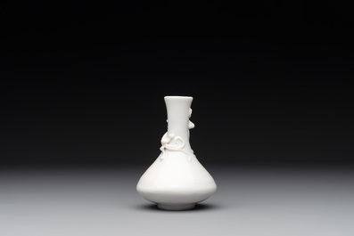 A small Chinese Dehua blanc de Chine 'dragon' bottle vase, Kangxi