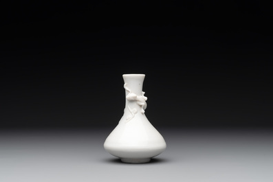 A small Chinese Dehua blanc de Chine 'dragon' bottle vase, Kangxi