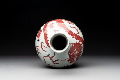 A Chinese copper-red and white 'dragon' bottle vase, 18th C.