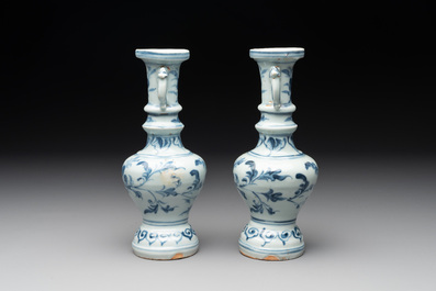 A pair of Chinese blue and white handled vases with floral design, Ming