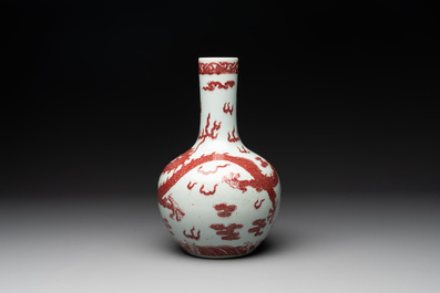A Chinese copper-red and white 'dragon' bottle vase, 18th C.