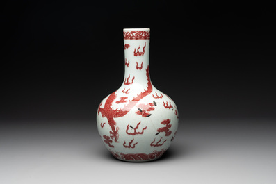 A Chinese copper-red and white 'dragon' bottle vase, 18th C.