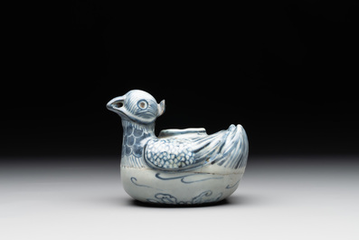 A Chinese blue and white 'double mandarin duck' ewer or water dropper on wooden stand, Ming, ca. 1500