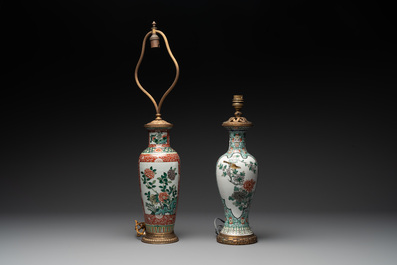A Chinese famille verte covered jar, two vases mounted as lamps and a tazza, 19th C.