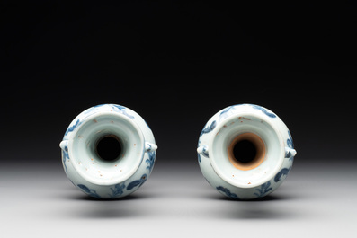 A pair of Chinese blue and white handled vases with floral design, Ming