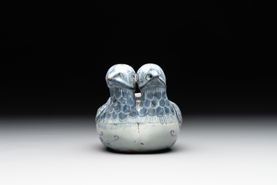A Chinese blue and white 'double mandarin duck' ewer or water dropper on wooden stand, Ming, ca. 1500