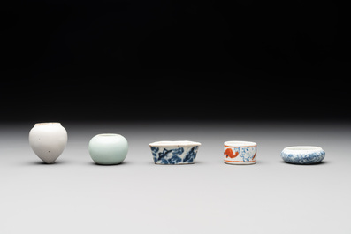 A collection of nine Chinese blue and white, monochrome and famille rose bird feeders, 19th C.