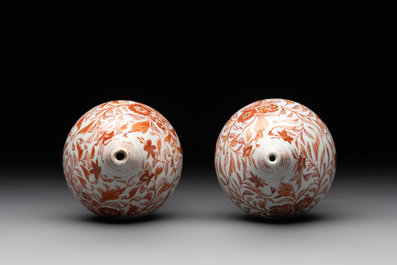 A pair of Chinese iron-red and gilt-decorated rose water sprinklers, Kangxi