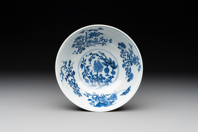 A Chinese blue, white and famille rose bowl with floral design, Qianlong mark, 19/20th C.