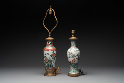 A Chinese famille verte covered jar, two vases mounted as lamps and a tazza, 19th C.