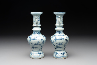 A pair of Chinese blue and white handled vases with floral design, Ming