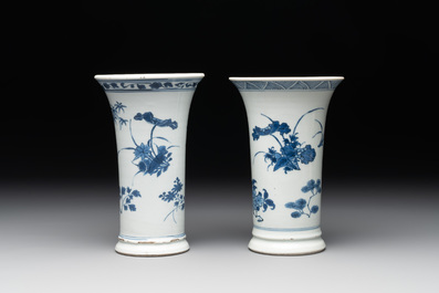 A pair of Chinese blue and white beaker vases with floral sprigs, Transitional period