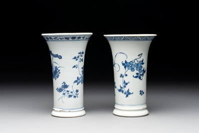 A pair of Chinese blue and white beaker vases with floral sprigs, Transitional period