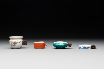 A collection of nine Chinese blue and white, monochrome and famille rose bird feeders, 19th C.