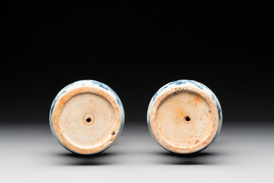 A pair of Chinese blue and white handled vases with floral design, Ming