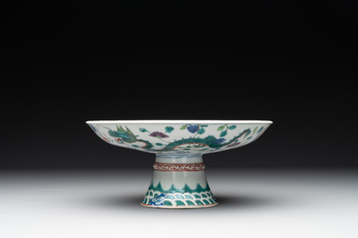A Chinese famille verte covered jar, two vases mounted as lamps and a tazza, 19th C.