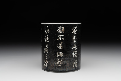 A Chinese black-glazed reverse-decorated 'poem' brush pot, 19th C.