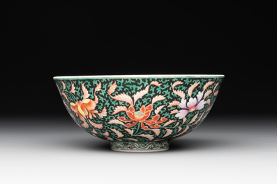 A Chinese black-ground famille rose 'flower scroll' bowl, Qianlong mark and of the period