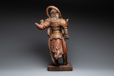 A large Chinese polychrome-lacquered wooden figure of a Guardian King, 18/19th C.