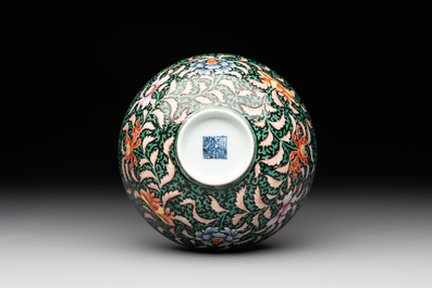 A Chinese black-ground famille rose 'flower scroll' bowl, Qianlong mark and of the period