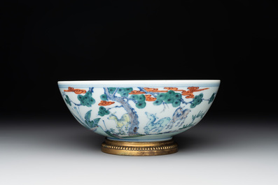 A Chinese doucai 'deer' bowl with gilt bronze stand, Chenghua mark, 18th C.