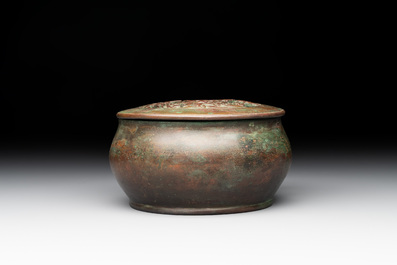 A rare Chinese bronze 'sage in a mountainous landscape' handwarmer, 17/18th C.