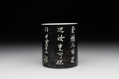 A Chinese black-glazed reverse-decorated 'poem' brush pot, 19th C.