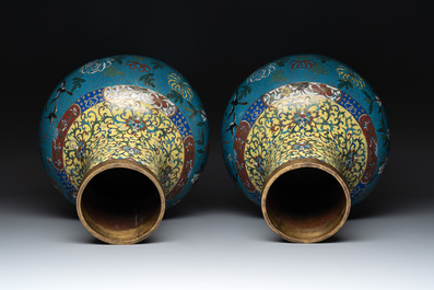 A pair of large Chinese cloisonn&eacute; 'magpies among flowering branches' vases, 19th C.