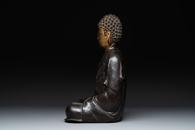 A large Chinese lacquered and gilt bronze Buddha, 17th C.
