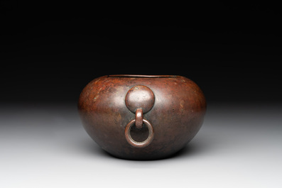 A Chinese bronze water pot with 'Taotie' handles, Xuande mark, 17/18th C.