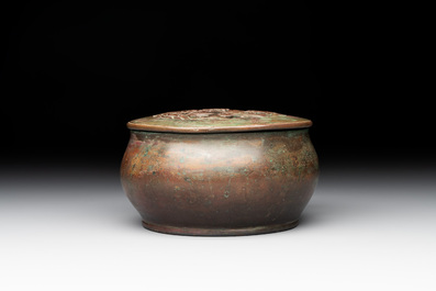A rare Chinese bronze 'sage in a mountainous landscape' handwarmer, 17/18th C.