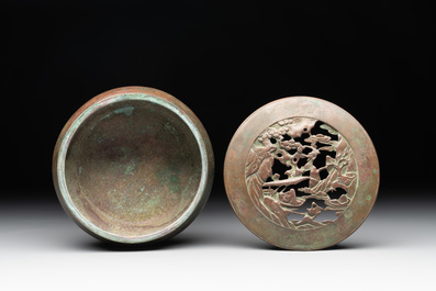 A rare Chinese bronze 'sage in a mountainous landscape' handwarmer, 17/18th C.
