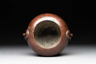 A Chinese bronze water pot with 'Taotie' handles, Xuande mark, 17/18th C.
