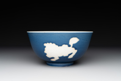 A Chinese powder blue-ground biscuit, blue and white 'Buddhist lion' bowl, Xuande mark, Kangxi