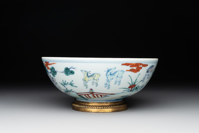 A Chinese doucai 'deer' bowl with gilt bronze stand, Chenghua mark, 18th C.