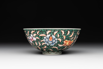 A Chinese black-ground famille rose 'flower scroll' bowl, Qianlong mark and of the period