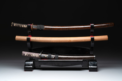 A collection of fine Japanese sword handles, guards, sheaths, a sword and a lacquered stand, Edo, 18/19th C.