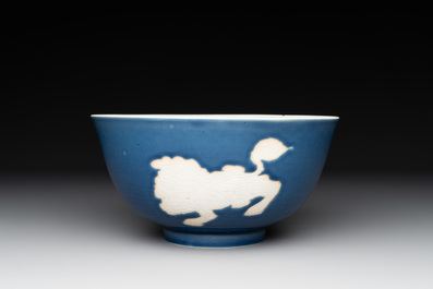 A Chinese powder blue-ground biscuit, blue and white 'Buddhist lion' bowl, Xuande mark, Kangxi