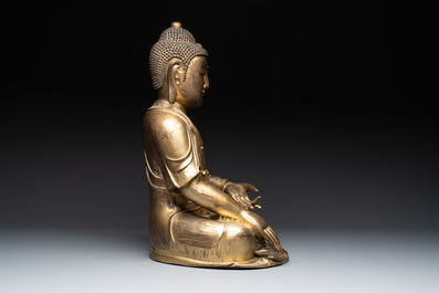 An impressive and large Chinese gilt bronze Buddha, Ming, 16th C.