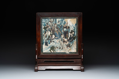 A pair of Chinese carved soapstone groups and a painted alabaster and wood table screen depicting a folk tale, 18/19th C.
