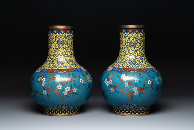 A pair of large Chinese cloisonn&eacute; 'magpies among flowering branches' vases, 19th C.