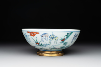 A Chinese doucai 'deer' bowl with gilt bronze stand, Chenghua mark, 18th C.