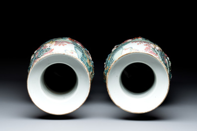 A pair of Chinese famille rose '18 luohan' vases with relief design, 19th C.
