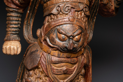 A large Chinese polychrome-lacquered wooden figure of a Guardian King, 18/19th C.