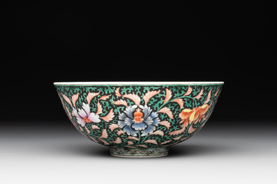 A Chinese black-ground famille rose 'flower scroll' bowl, Qianlong mark and of the period