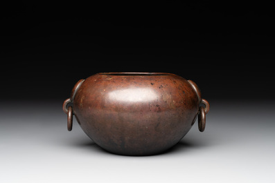 A Chinese bronze water pot with 'Taotie' handles, Xuande mark, 17/18th C.