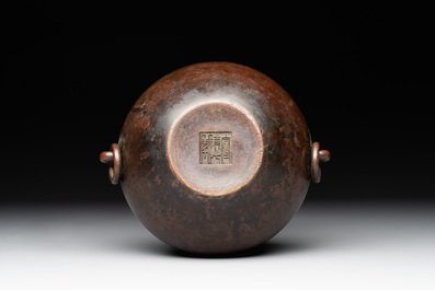 A Chinese bronze water pot with 'Taotie' handles, Xuande mark, 17/18th C.